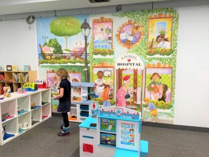 Animal Hospital Wall Mural, as seen in this preschool at Batter Zone in Hamilton, Ontario, is a veterinarian wallpaper for kids featuring a cow, pig, giraffe, mouse, alligator, zebra, bunny rabbit, cat, dog, turtle, bird and lizard from About Murals.