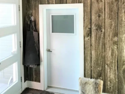 Barn Wood Wallpaper, as seen on the wall of this foyer entryway, features brown reclaimed wooden planks. Faux wood wallpaper sold by AboutMurals.ca.
