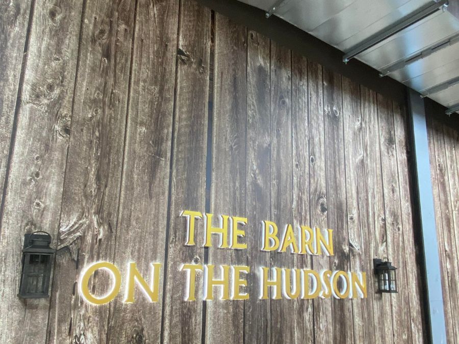 Barn Wood Wallpaper, as seen on the wall of this restaurant called "The Barn on the Hudson", is a high resolution photo mural of a rustic wood wall that looks realistic from About Murals.