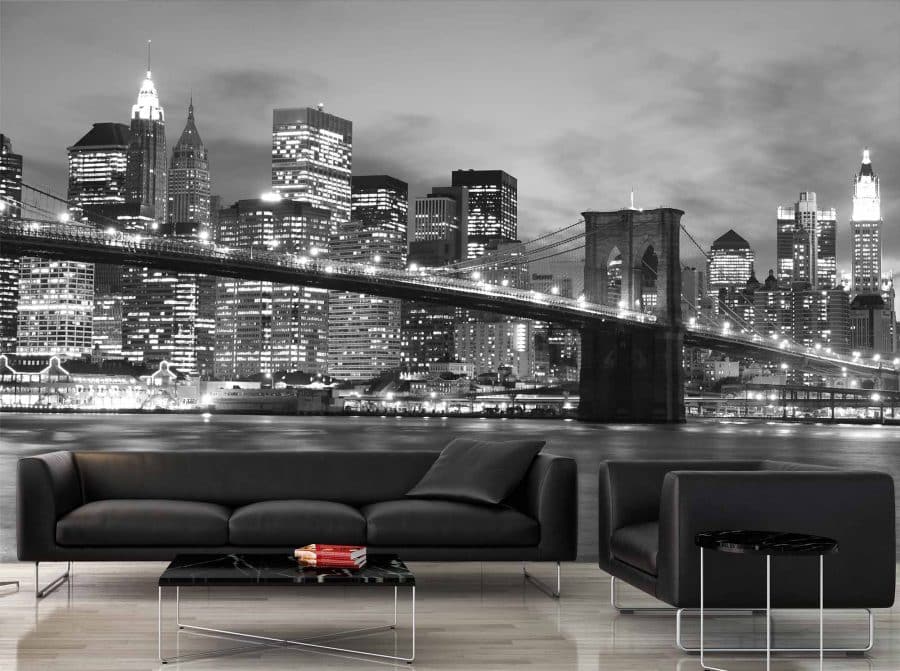 NYC Bridge Wallpaper, as seen on the wall of this dark living room, is a photo wallpaper of the suspension bridge in New York City from About Murals.