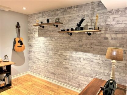 Old Brick Wall Mural Light Black and White, as seen in this home office, is a grey brick wallpaper with realistic texture from About Murals.