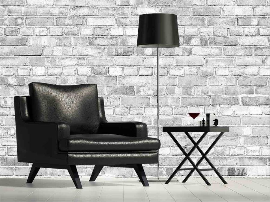 Old Brick Wall Mural Light Black and White, as seen in this sitting room, is a grey brick wallpaper that adds tons of texture to walls from About Murals.