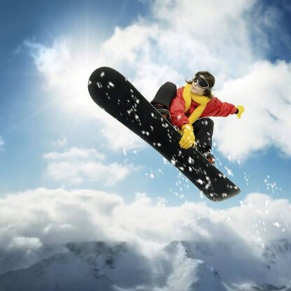 Snowboard Wallpaper is a sports mural featuring a girl jumping in a blue sky, over snowy mountains from About Murals.
