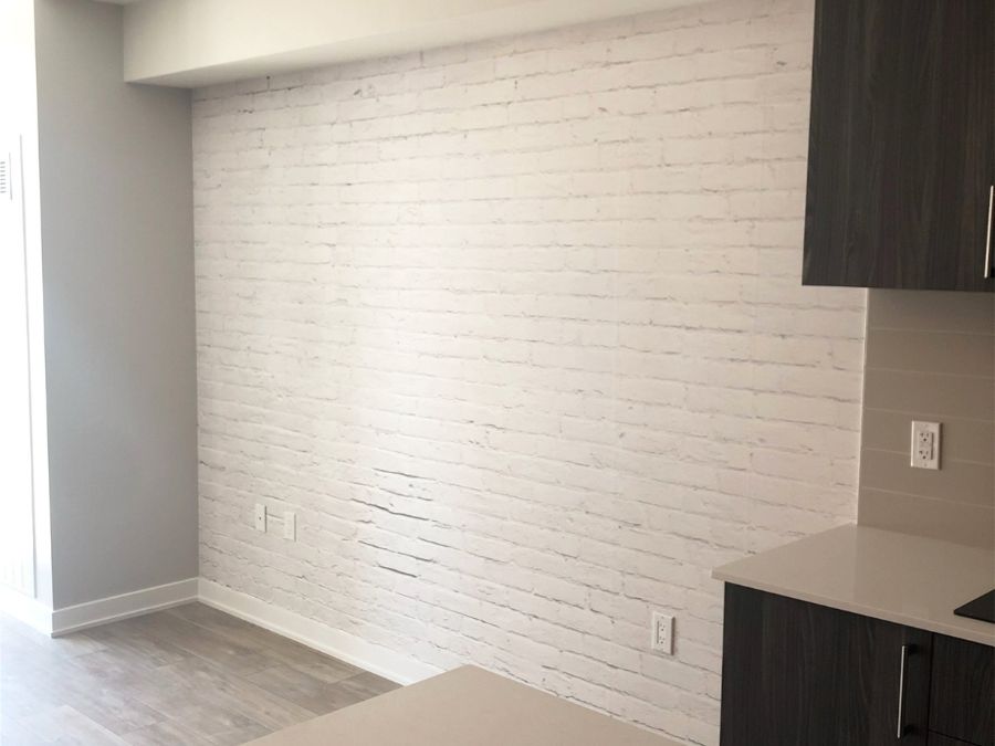 White Brick Wall Mural, as seen in this kitchen, is a high resolution photo wallpaper of realistic white washed bricks from About Murals.