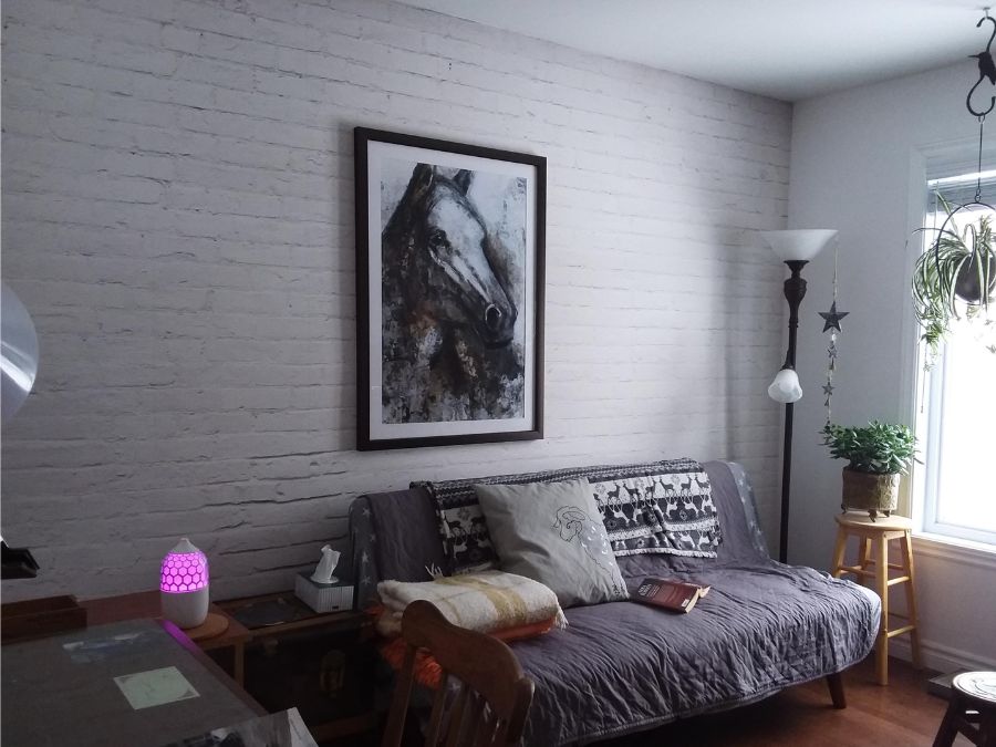 White Brick Wall Mural, as seen in this room, is a white brick effect wallpaper created from a high res photo from About Murals.