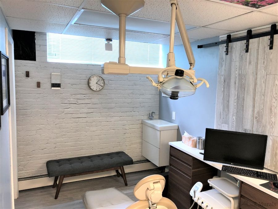 White Brick Wallpaper, as seen in this dentist office, creates a textured look on walls with its white painted bricks. Brick wallpaper sold by AboutMurals.ca.