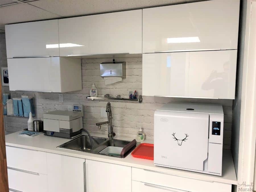 White Brick Wall Mural, as seen in this dental clinic, adds a ton of texture to walls with white painted bricks. Brick wallpaper sold by AboutMurals.ca.