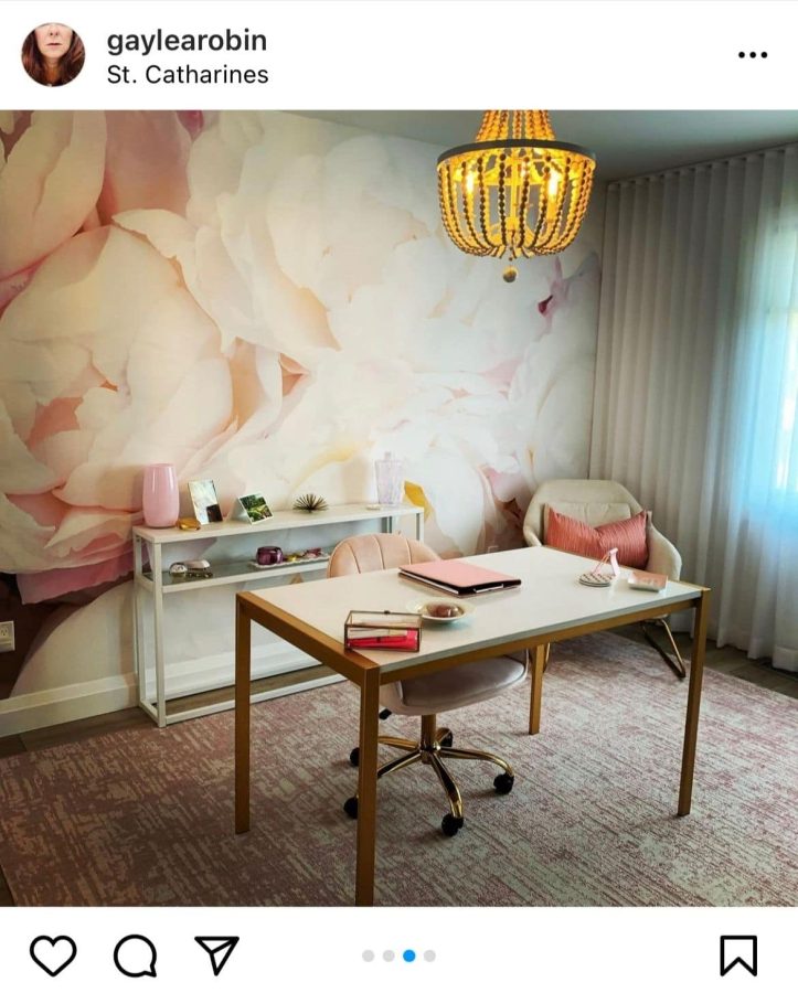 Custom Floral Wallpaper, as seen on the wall of this home office, is a photo mural of pink peonies from About Murals.