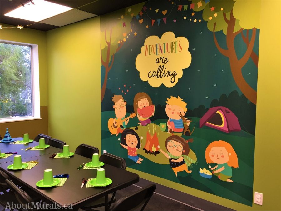 Custom Wallpaper, as seen on the wall of this birthday party event space in Hamilton, Ontario, is a mural with kids camping under a starry sky from About Murals.
