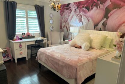 Peony Wallpaper, as seen on the wall of this girls room, is a photo mural of large peony flowers in pink and white tones from About Murals.