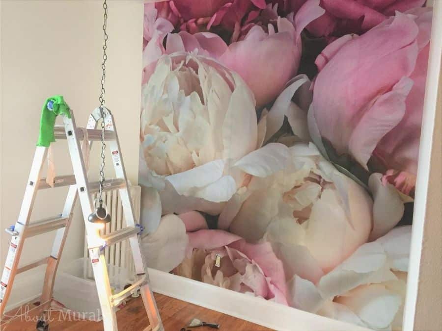 Peony Wallpaper, as seen on the wall of this room, features large pink and white flowers. Floral wallpaper sold by AboutMurals.ca.