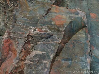 Rock Face Wallpaper features rugged texture with its gray and rust coloured stone wall. Stone wallpaper sold by AboutMurals.ca.