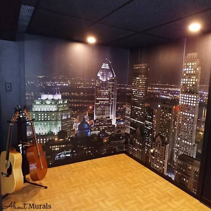 Montreal Downtown Wallpaper, as seen in this music room, is a wall mural of tall buildings in Canada lit up against a black nighttime sky from About Murals.