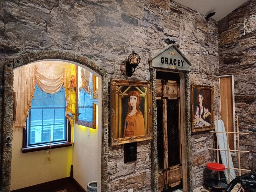 Castle Stone Wallpaper, as seen on the wall of this Disney Haunted Mansion themed room, is a high resolution photo mural of realistic, textured brown and beige stones from About Murals.