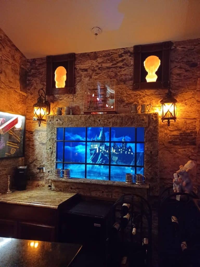 Castle Stone Wallpaper, as seen on the wall of this Hogwarts inspired room, is a realistic photo mural of brown stones from About Murals.