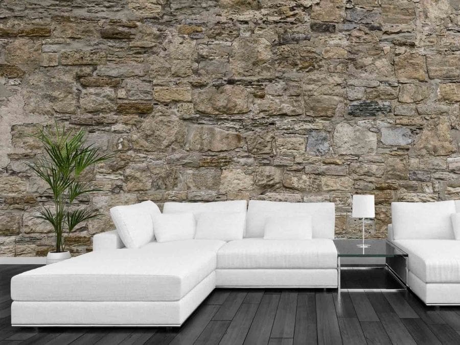 Castle Stone Wallpaper, as seen on the wall of this neutral living room, is a photo mural of textured brown and beige stones from About Murals.