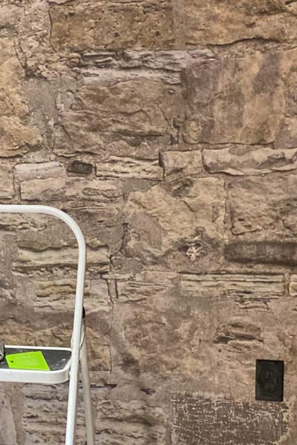 Castle Stone Wallpaper is a realistic photo mural of brown stacked stones from About Murals.