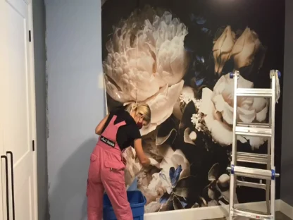 Black Floral Wallpaper features an easy installation process as shown by this professional wallpaper installer from About Murals