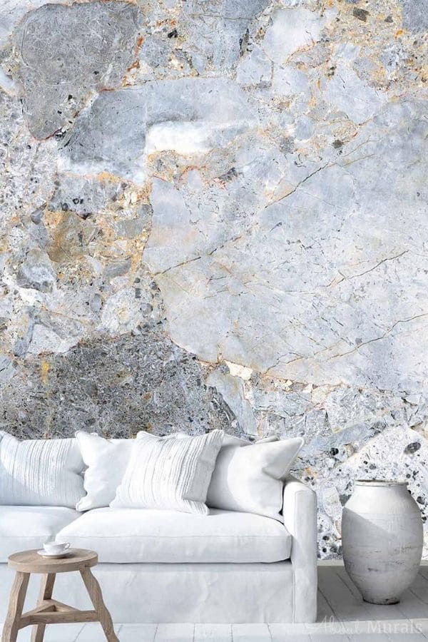Gold Marble Wallpaper, as seen on the wall of this living room, is a photo mural of grey marble with gold veins that creates an elegant effect from About Murals.