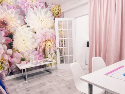 Pink Flower Wallpaper, as seen on the wall of this spa, is a beautiful floral mural created from a photograph of beautiful large dahlias from About Murals.