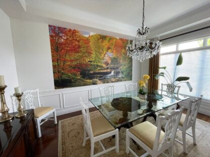 Watermill Wallpaper, as seen on the wall of this elegant dining room, is a high resolution photo mural of a watermill in an autumn forest from About Murals.