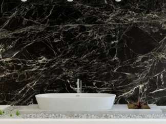 Black Marble Wallpaper, as seen on the wall of this bathroom, feels sophisticated with its white veins flowing through dark stone. Marble wallpaper sold by About Murals Canada.