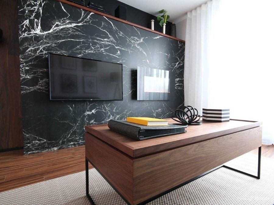 Black Marble Wallpaper, as seen on the wall of this office, creates a flawless look with its white veins flowing through dark stone. Marble wall murals sold by AboutMurals.ca.