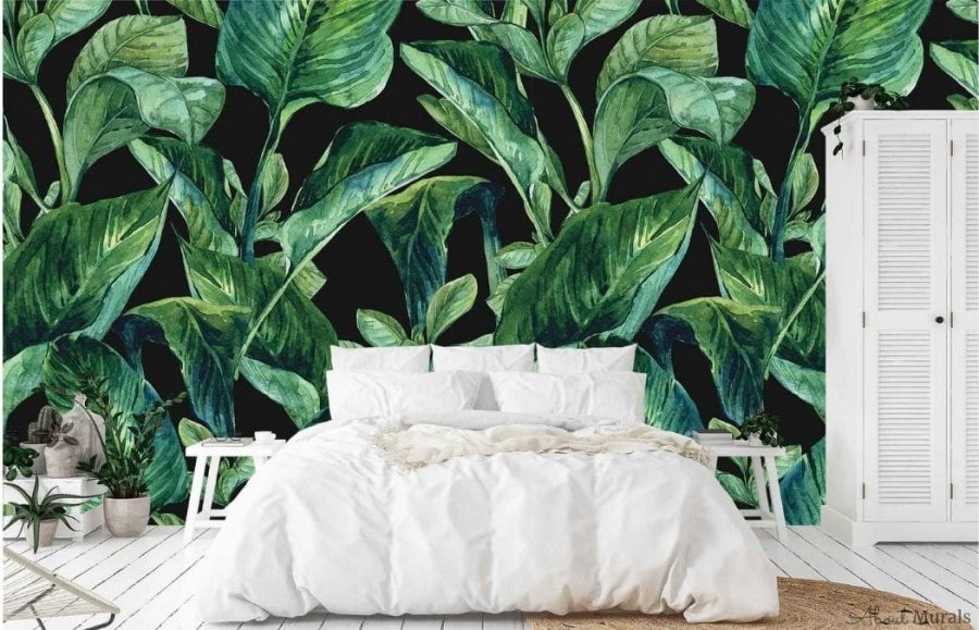 Dark Tropical Wallpaper, as seen on the wall of this bedroom, is a beautiful wall mural with modern tropical leaves on a black background from About Murals.