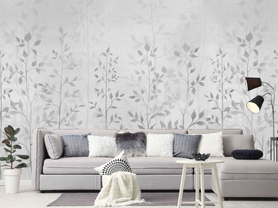 Grey Leaf Wallpaper, as seen on the wall of this living room, features tall, leafy plants on a canvas textured background from About Murals.