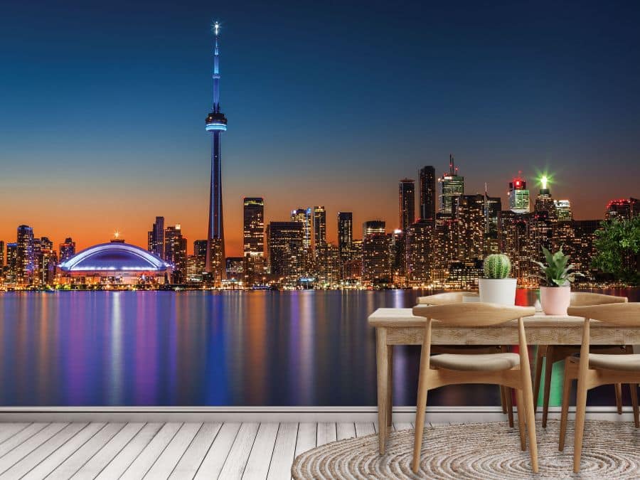 Toronto Skyline Wallpaper, as seen on the wall of this kitchen, is a gorgeous photo wall mural of the CN Tower, Rogers Centre and skyscrapers in downtown Toronto under a blue and orange night sky from About Murals.