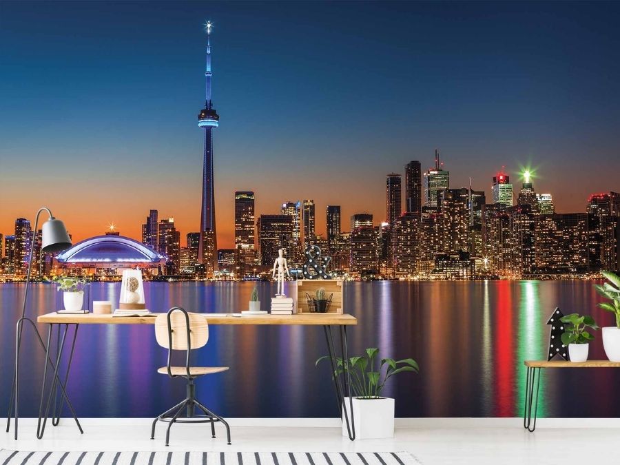 Toronto Skyline Wallpaper, as seen on the wall of this modern office, is a photo mural of the CN Tower, Rogers Centre and twinkling skyscrapers over Lake Ontario at night from About Murals.