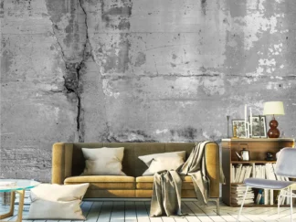 Cracked Concrete Wallpaper, as seen on the wall of this grey and yellow living room, is a realistic, distressed design from About Murals.