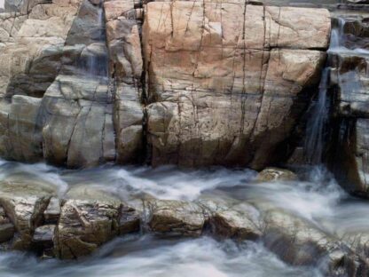 Flowing Water Wallpaper is a wall mural of rocky Dorwin Falls in Quebec from About Murals.