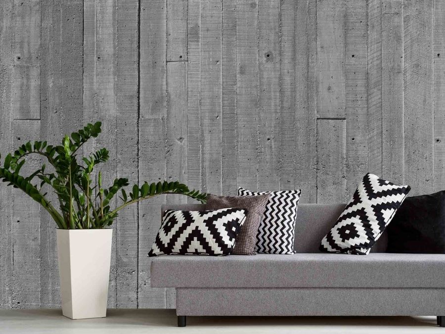 Concrete Look Wallpaper, as seen on the wall of this living room, is a photo mural of a wood texture concrete wall from About Murals.