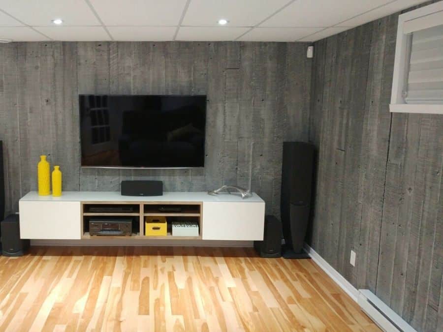 Concrete Look Wallpaper, as seen on the wall of this TV Room, is a photo wall mural of vertical concrete slabs from About Murals.