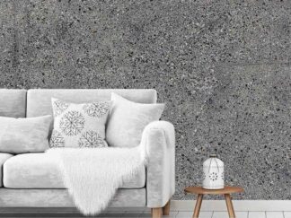 Concrete Stone Wallpaper, as seen on the wall of this living room, is a photo mural of exposed aggregate from About Murals.