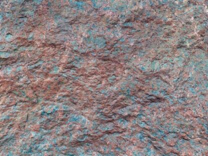 Copper and Teal Stone Wallpaper is a photo mural of a rock face wall from About Murals.