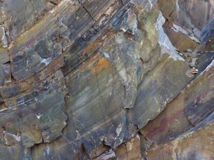 Rock Texture Wallpaper is a photo mural of a colorful rock face wall from About Murals.