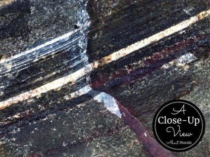 A close-up view of a colorful rock texture wallpaper from About Murals.