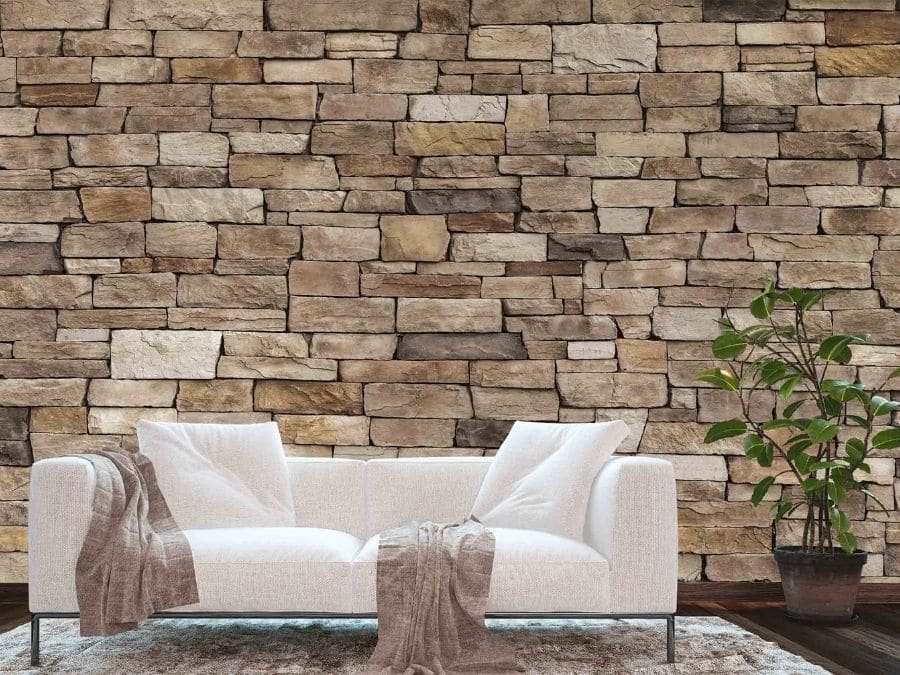 Stone Look Wallpaper, as seen on the wall of this beige living room, is a photo mural of a tan coloured stone wall from About Murals.
