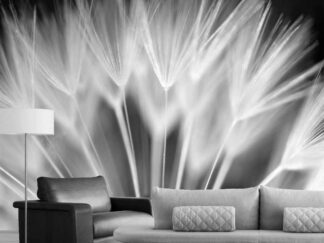 Dandelion Wallpaper, as seen on the wall of the living room, is a floral mural with large, black and white dandelion seeds from About Murals.