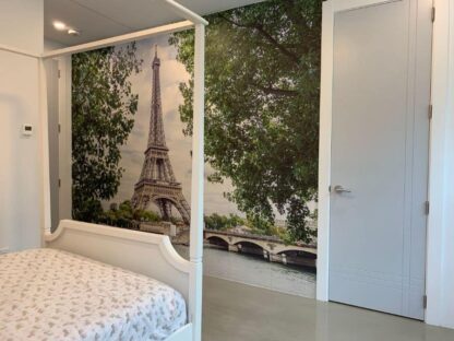 Eiffel Tower Wallpaper, as seen on the wall of this girls bedroom, is a photo mural of the famous tourist attraction overlooking the River Seine in Paris, France from About Murals.