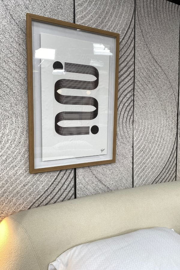 Scandi Leaf Wallpaper, as seen on the wall behind Cityline's zen wall art designed by Colin and Justin, is a zen mural with a simple leaf pattern raked into black and white sand from About Murals.
