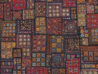 Tapestry Wallpaper is a burgundy patchwork embroidery from India with circle, diamond, star and square geometric shapes from About Murals.