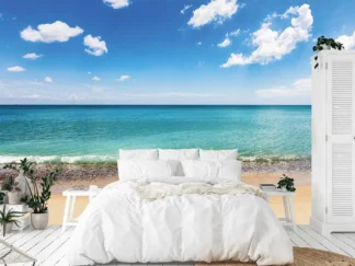 Beach Scene Wallpaper, as seen on the wall of this beach themed bedroom, is a photo mural of the calm ocean next to a tropical beach from About Murals.