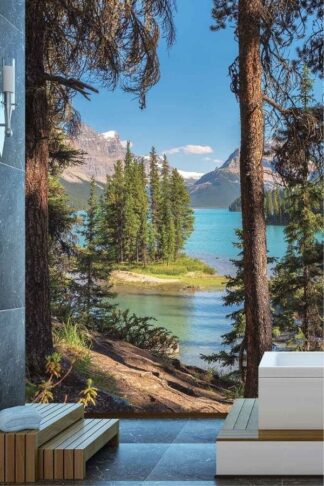 Jasper Wallpaper, as seen on the wall of this bathroom, is a photo mural of pine trees on Spirit Island with the Canadian Rocky Mountains behind Maligne Lake from About Murals.
