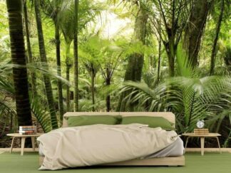 Lush Forest Wallpaper, as seen on the wall of this bedroom, is a photo mural of palm trees in the rainforest from About Murals.
