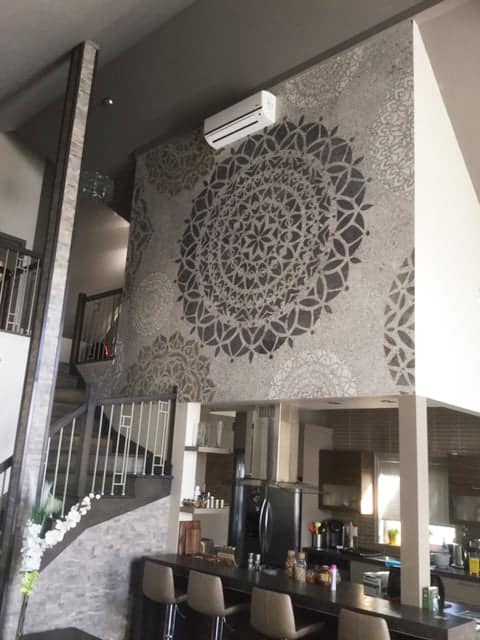Mandala Wallpaper, as seen on the wall of this kitchen, is a spiritual mural with geometric circle patterns in grey from About Murals.