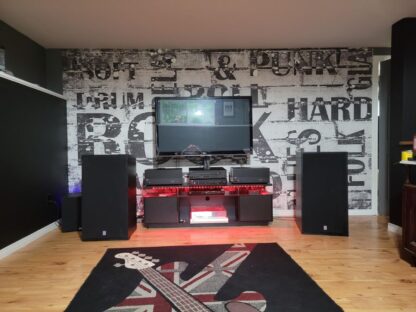 Music Words Wallpaper, as seen on the wall of this man cave, is a black and white mural with cool words like Garage, Metal, Jazz, Punk, Rock and Blues from About Murals.