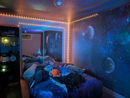 Planets Wallpaper Mural, as seen on the wall of this kids room, is a wall mural with stars and planets in a far away galaxy from About Murals.